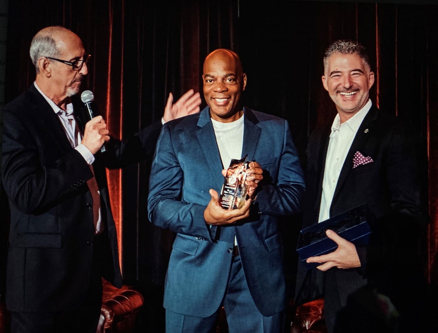 presenter and recipients at the we benefit children 35th anniversary