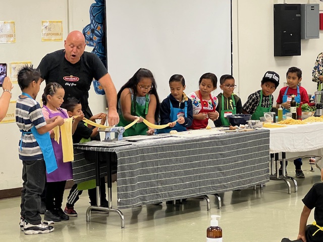 kids learning to make pasta, hands-on cooking class event