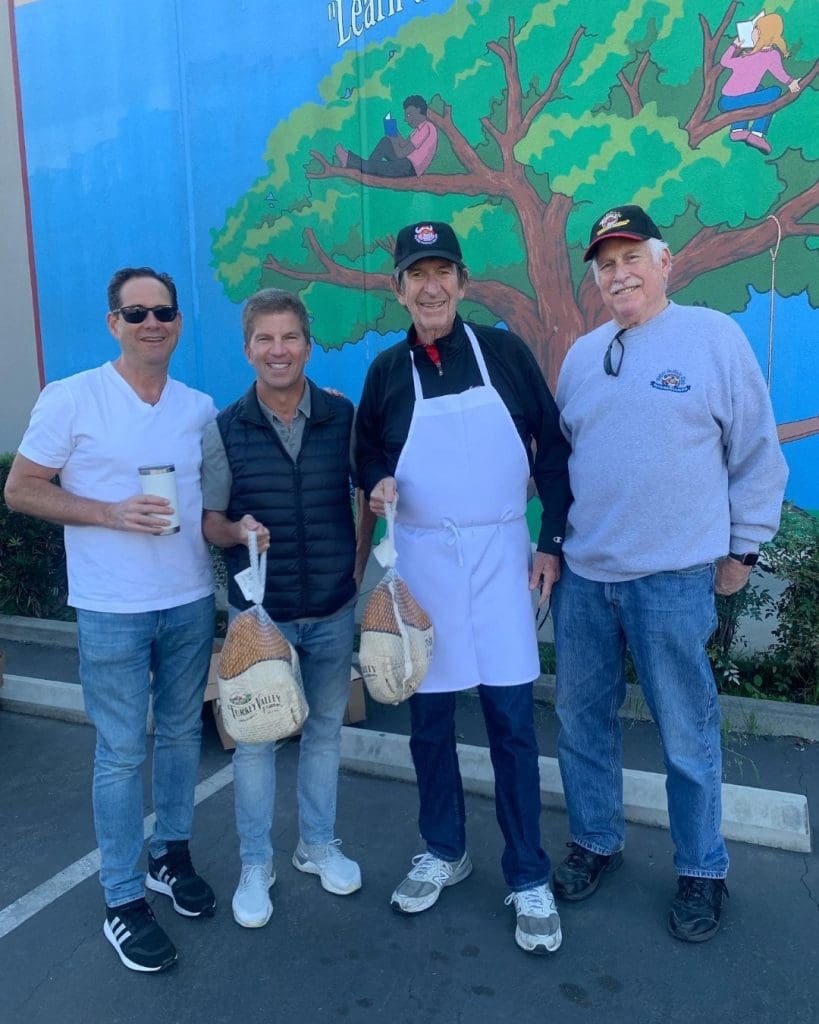 four volunteers at the Thanksgiving event.